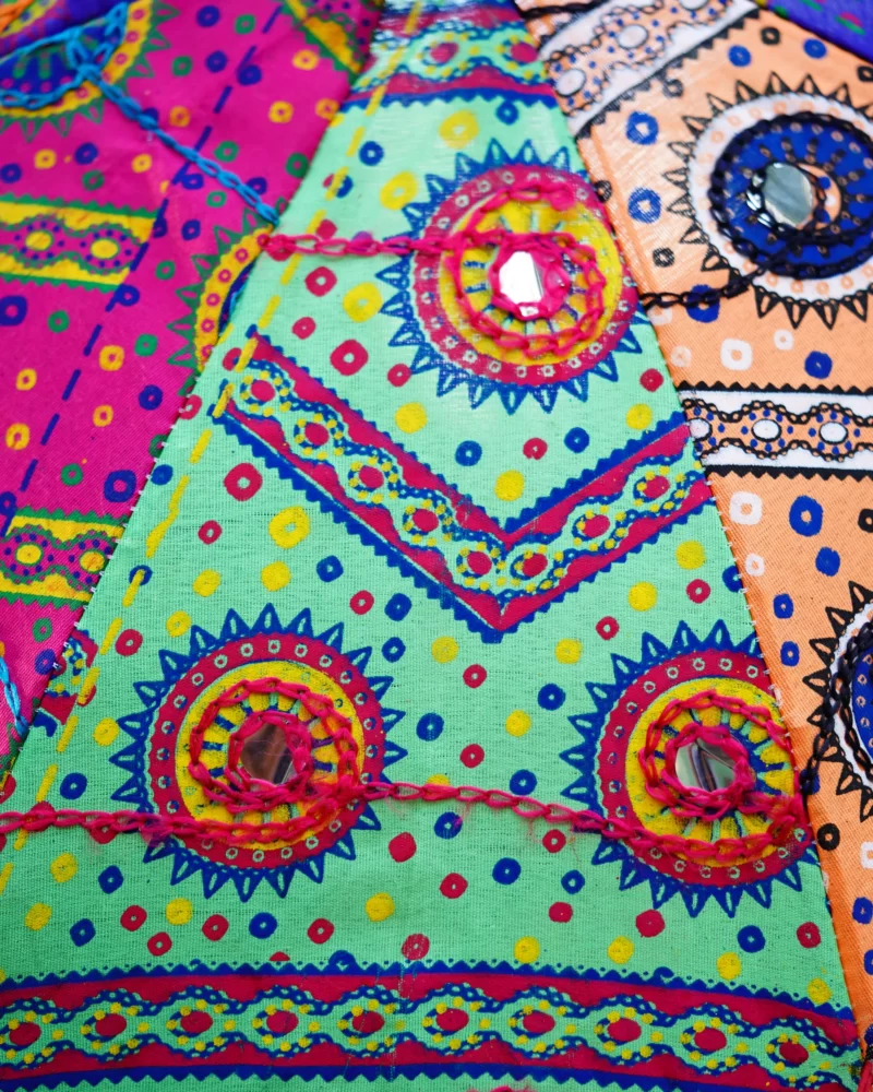 Close-up of the handcrafted Rajasthani umbrella, highlighting the detailed embroidery and craftsmanship