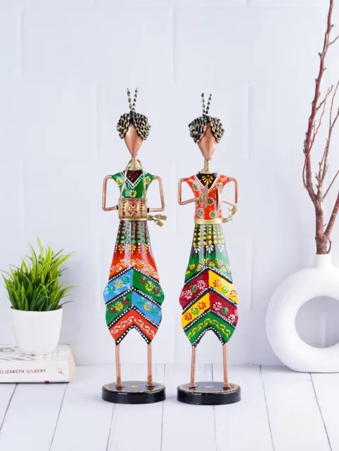 Vibrant standing pair of tribal musicians, showcasing the artistic beauty of wrought iron craftsmanship